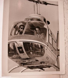 James W. Gavin pilots a helicopter with Efrem Zimbalist Jr.